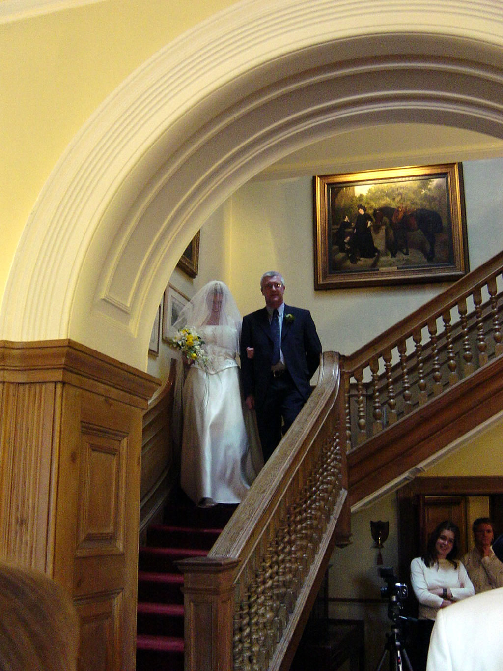 Charlotte & Kingsley Ash decending the staircase