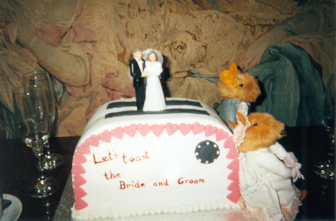 two mice guard a wedding cake