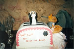 19. two mice guard a wedding cake